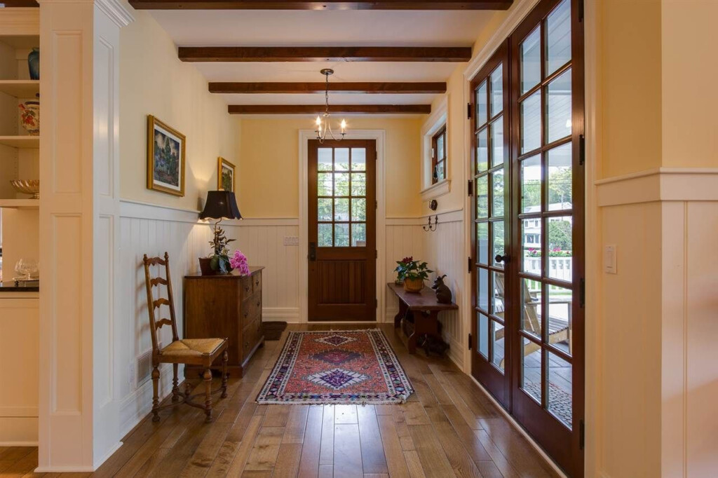 Double door Entry With Wood Floors And Beamed Ceiling Http www 